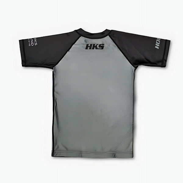 Hooks Kids 2026 Ranked BJJ Rash Guard Grey, back view flat lay with black raglan sleeves and HKS logo at collar