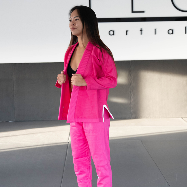 Hooks Pastel BJJ Gi in Pink, worn front view showing open lapel and white jacket tie detail