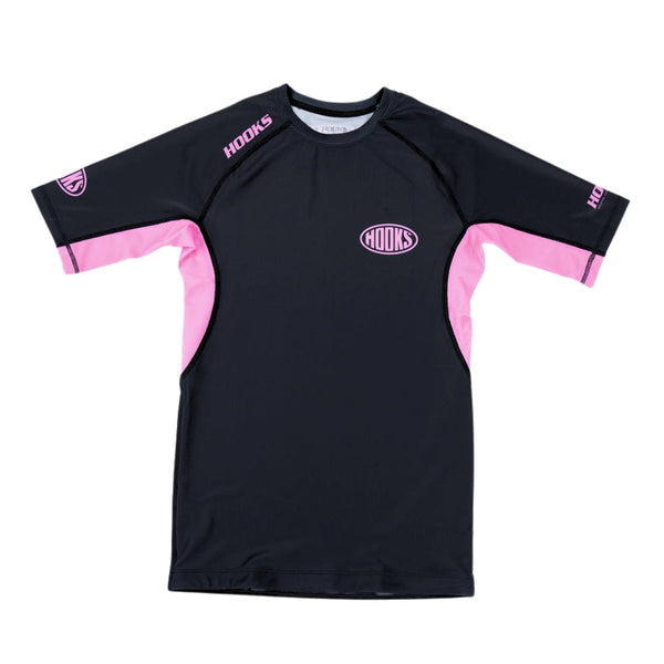 Hooks Short Sleeve Rash Guard Rose Noir, front flat lay showing black body with pink side panels and chest logo