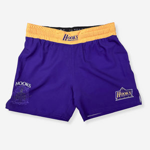 Purple shorts with yellow waistband featuring 'Hooks' branding on a white background