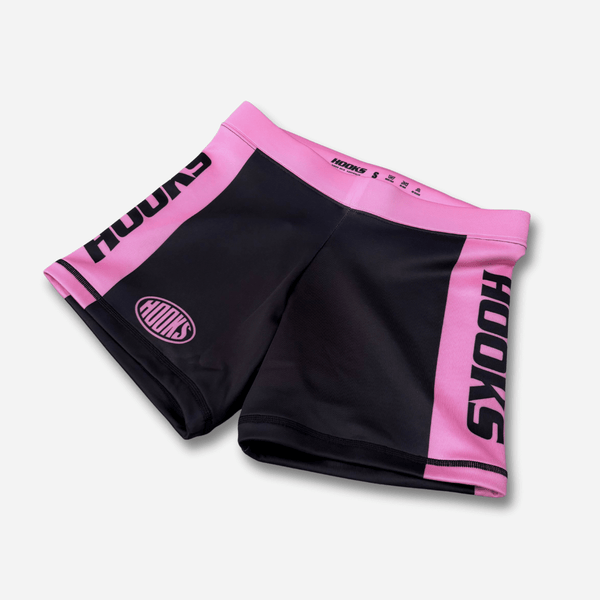 Hooks Flex Women's Shorts Rose Noir, front flat lay showing black body with pink side panels, waistband, and bold Hooks