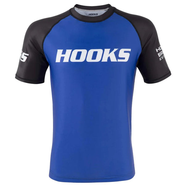Hooks Competitor No-Gi Bundle, front view of blue short-sleeve rash guard with black raglan sleeves and white Hooks chest
