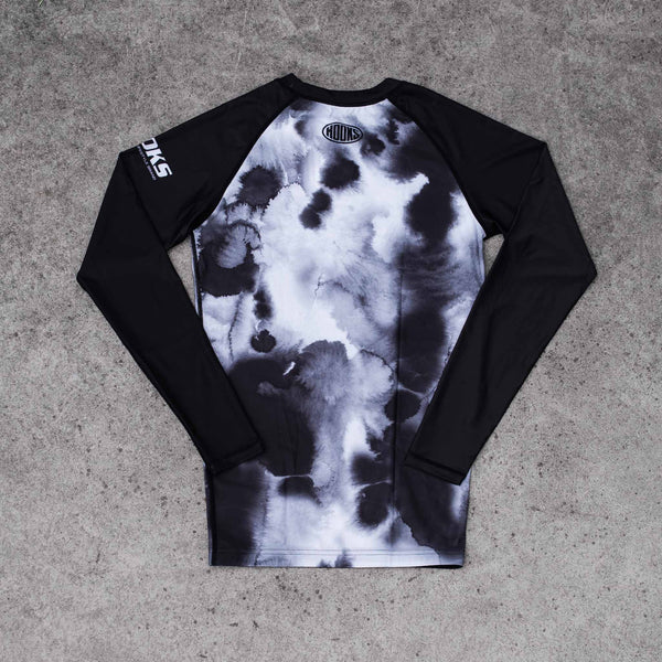 Hooks BJJ Long Sleeve Rash Guard - Black Mist, back view flat lay showing ink-wash body panel and solid black raglan sleeves