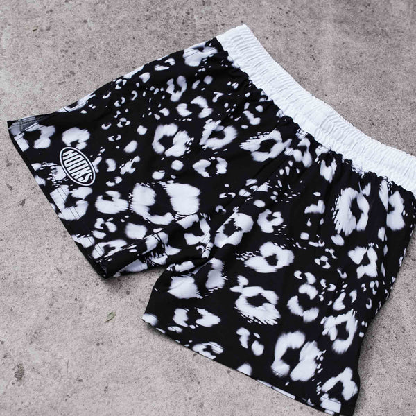 Hooks MMA & Grappling Shorts in Prowl, flat lay showing black-and-white leopard print and white elasticated waistband.