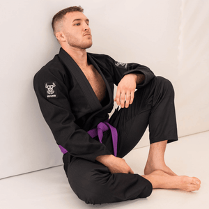 Headstrong Gi full set worn, seated pose showing full uniform