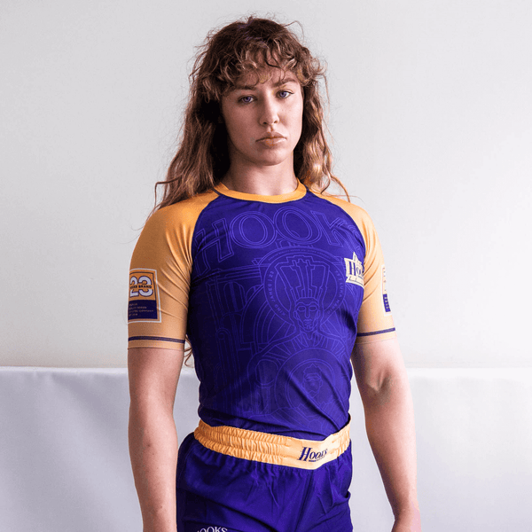 Athlete wearing the purple Showtime rashguard, front view.