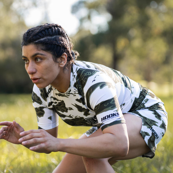 Close-up of white tiger camo pattern on rash guard
