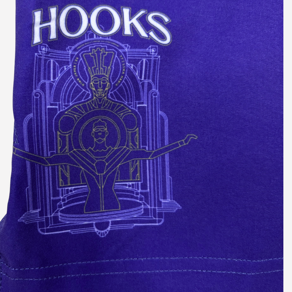Purple t-shirt with 'HOOKS' text and artistic design on a blue background