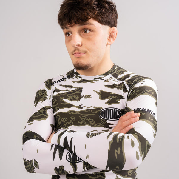 No-gi athlete wearing white tiger camo rash guard