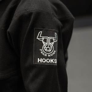 Close-up of sleeve design and stitching on Kids Headstrong BJJ Gi