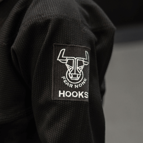 Close-up of sleeve design and stitching on Kids Headstrong BJJ Gi
