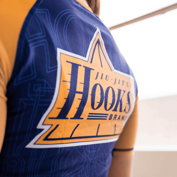 Close-up of the chest print on the purple Showtime rashguard