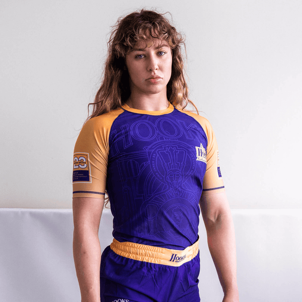 Athlete wearing the purple Showtime rashguard, front view.