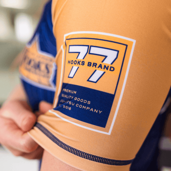 Close-up of the left sleeve print on the purple Showtime rashguard.