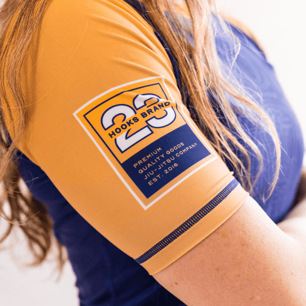 Close-up of the right sleeve print on the purple Showtime rashguard.